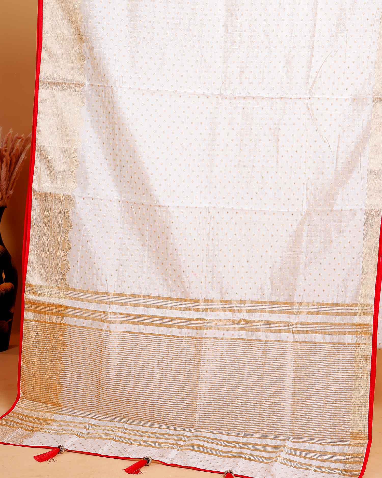 Off White  Art Silk Saree with Golden Zari & Buti Pattern Enhanced with Red Border Without Blouse