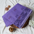 Bengal Cotton Saree With Subtle Floral And Abstract Woven Motifs In Purple Folded Close Up Display View