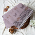 Bengal Cotton Saree With Subtle Floral And Abstract Woven Motifs In Light Brown Folded Close Up Display View