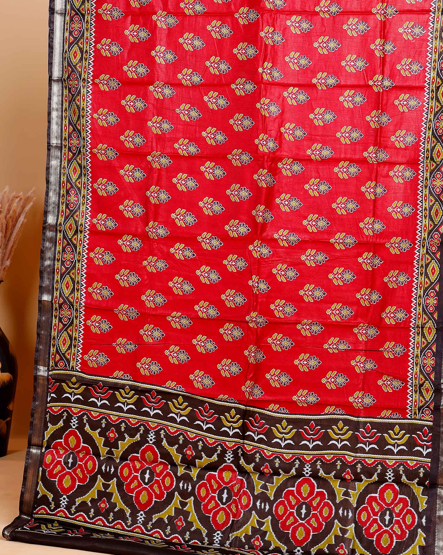 Rich Maroon Patola Silk Saree with Intricate Floral Motifs and Black Contrast Pallu