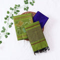 Top View Of Light Green And Blue Salwar Suit Material With Striped Dupatta, Ikkat Woven Border, Tassel Details & Fabric Piece