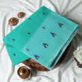 Aqua Blue Bengal Cotton Saree With Contrast White Striped Border And Woven Motifs Close Up Draped View