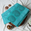 Bengal Cotton Saree With Woven Floral Jaal Motifs In Aqua  Blue Folded Close Up View With Striped Border Detail
