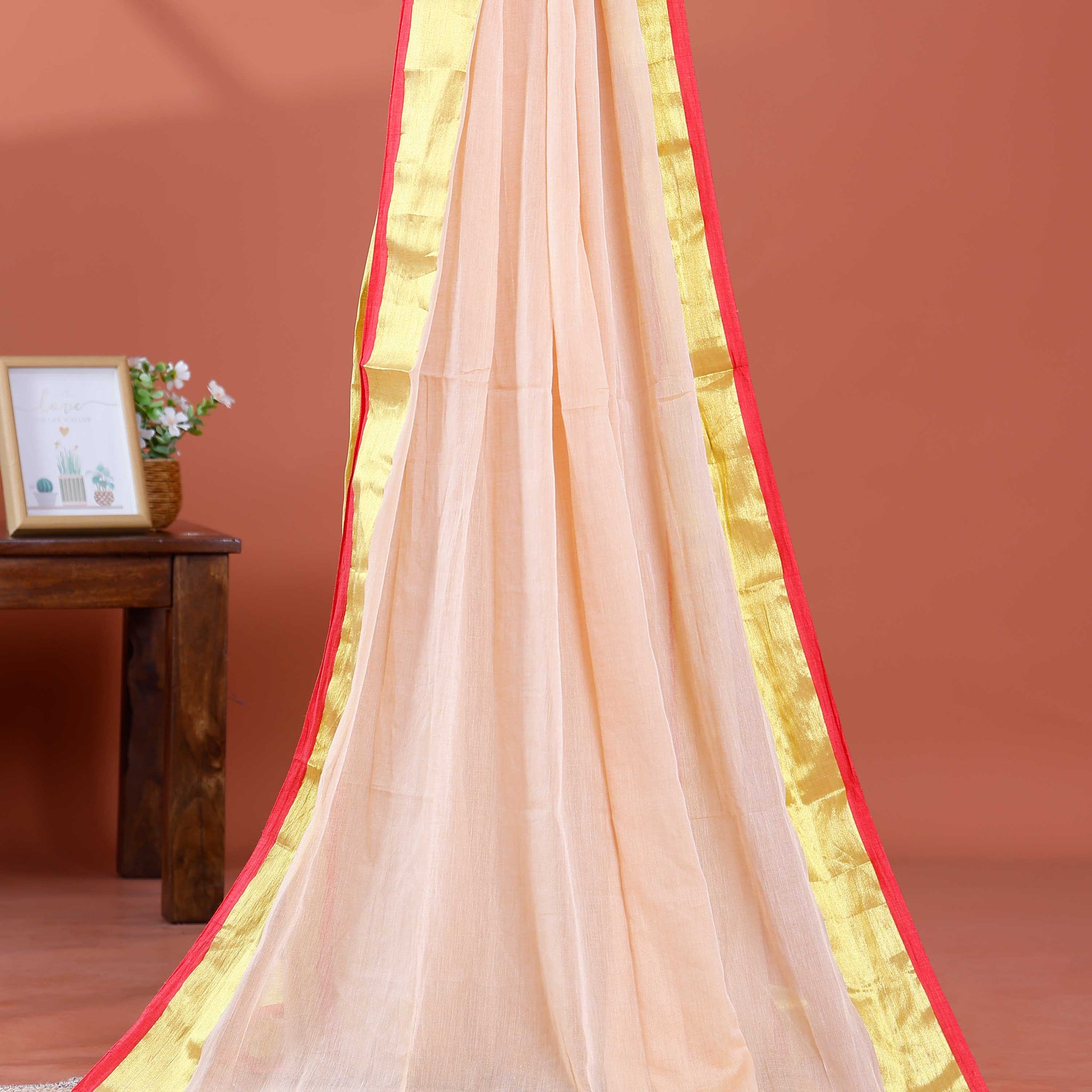 Handwoven Mul Mul Cotton Saree with Subtle Sheen and Contrasting Border – Peach