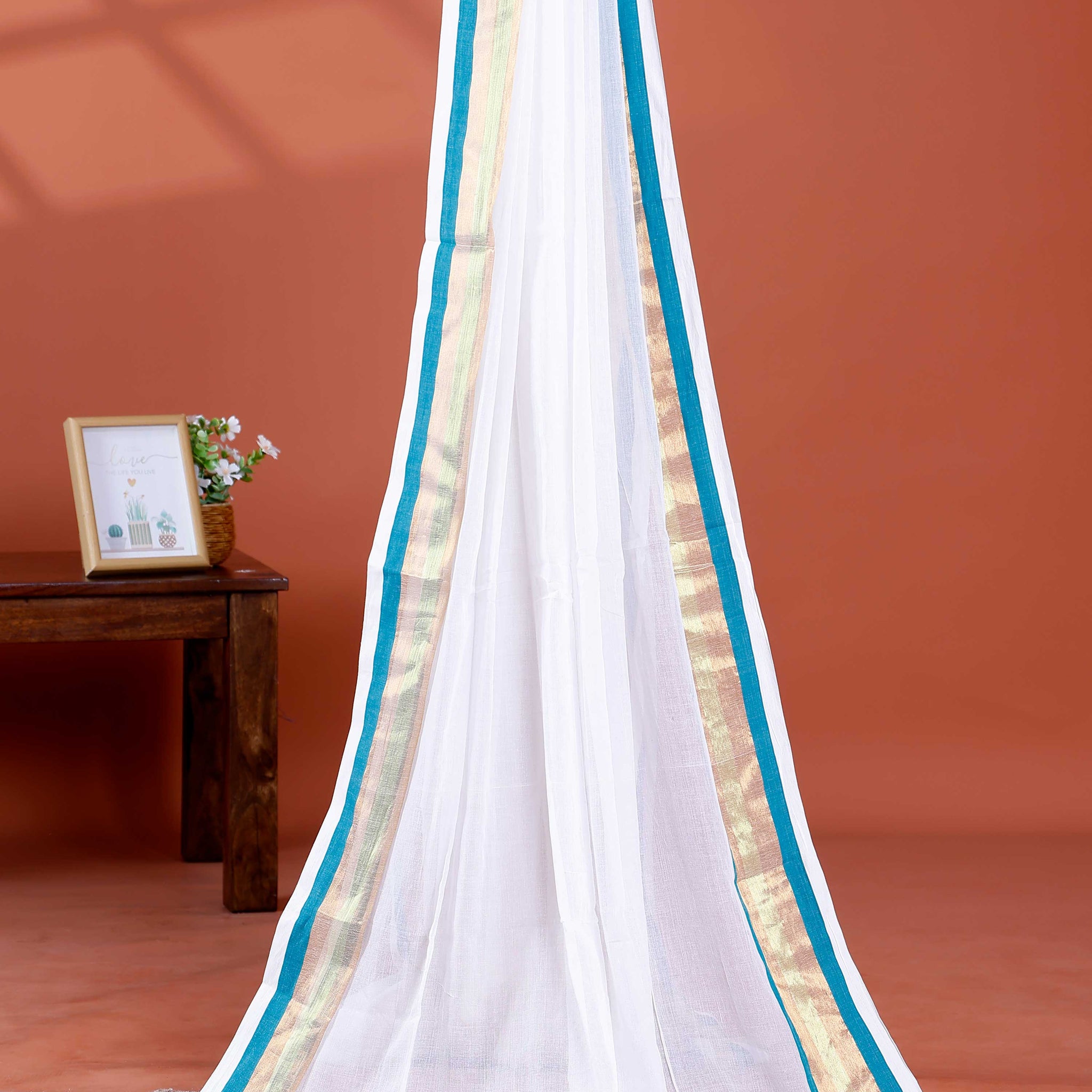 Handwoven Mul Mul Cotton Saree with Subtle Sheen and Contrasting Border – White