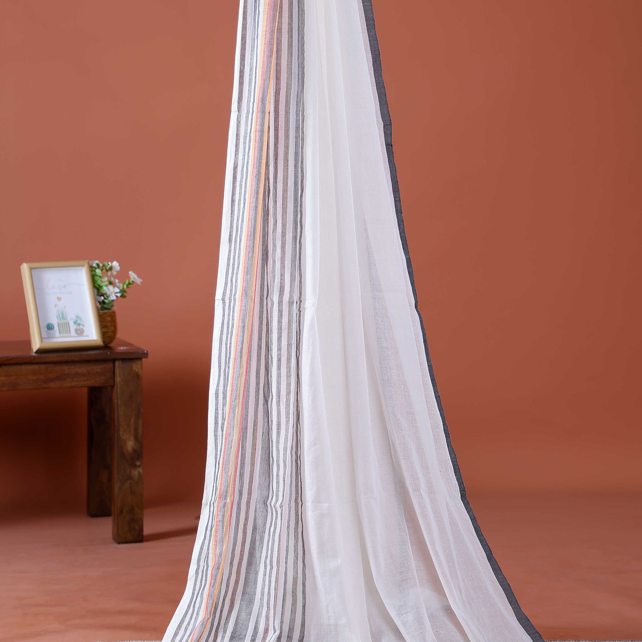 Handwoven Mul Mul Cotton Saree with Classic Striped Design and Colorful Tassel Accents – White