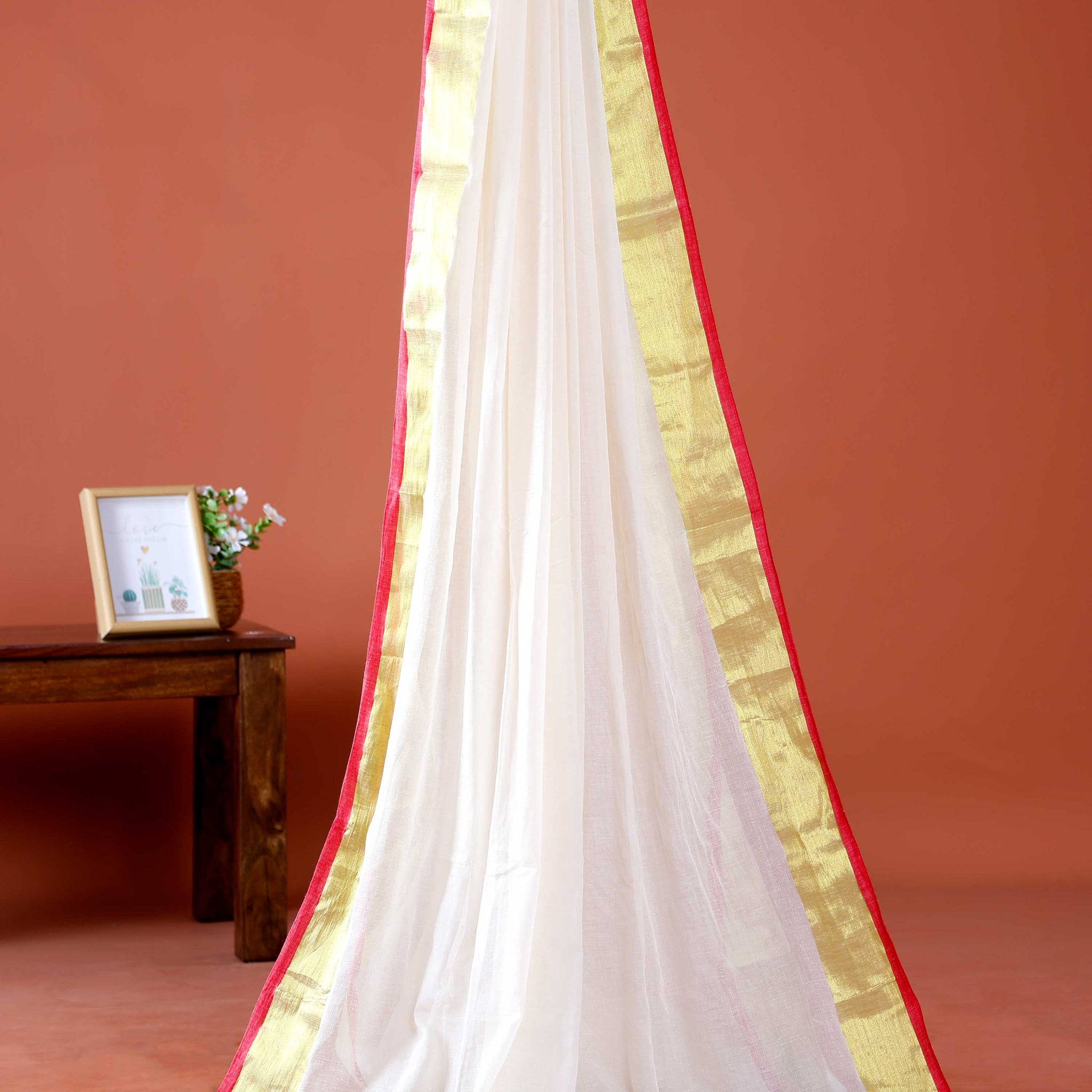 Handwoven Mul Mul Cotton Saree with Subtle Striped Pattern and Contrast Tassel Detailing – White