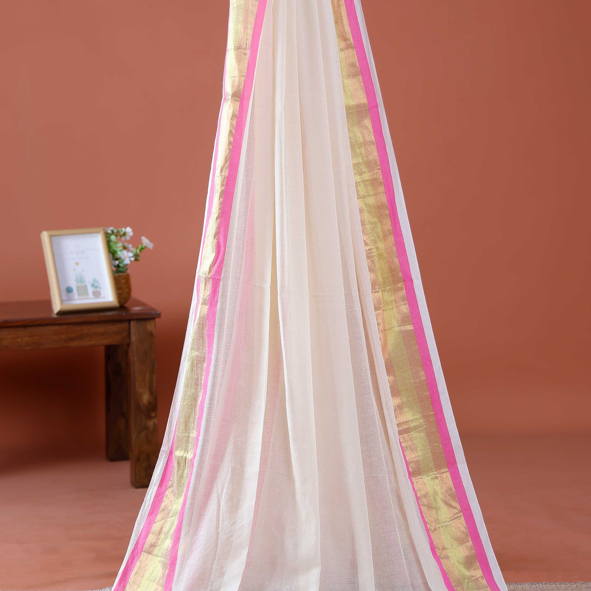 Handwoven Mul Mul Cotton Saree with Subtle Striped Pattern and Contrast Tassel Detailing – White