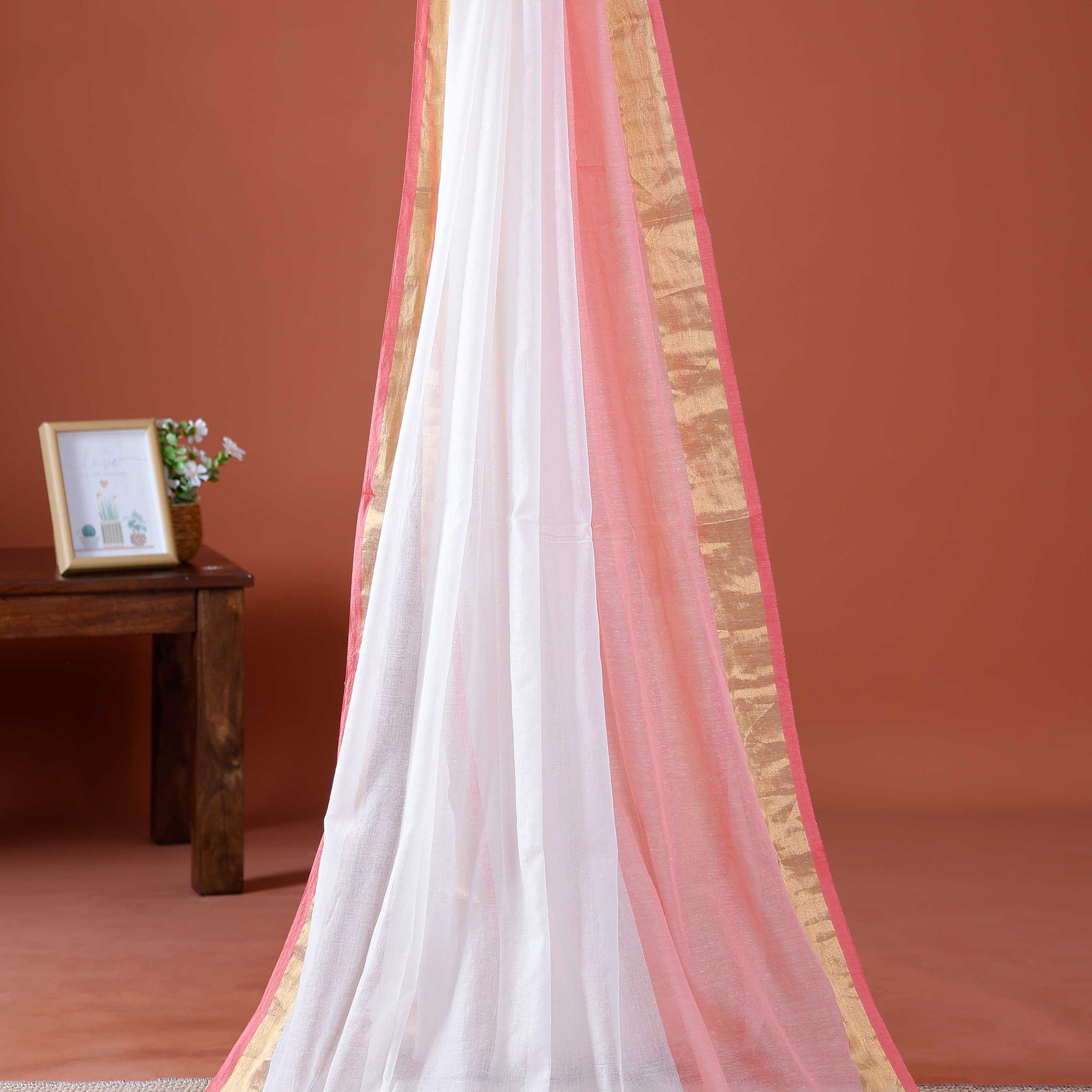 Handwoven Mul Mul Cotton Saree with Subtle Striped Pattern and Contrast Tassel Detailing – White