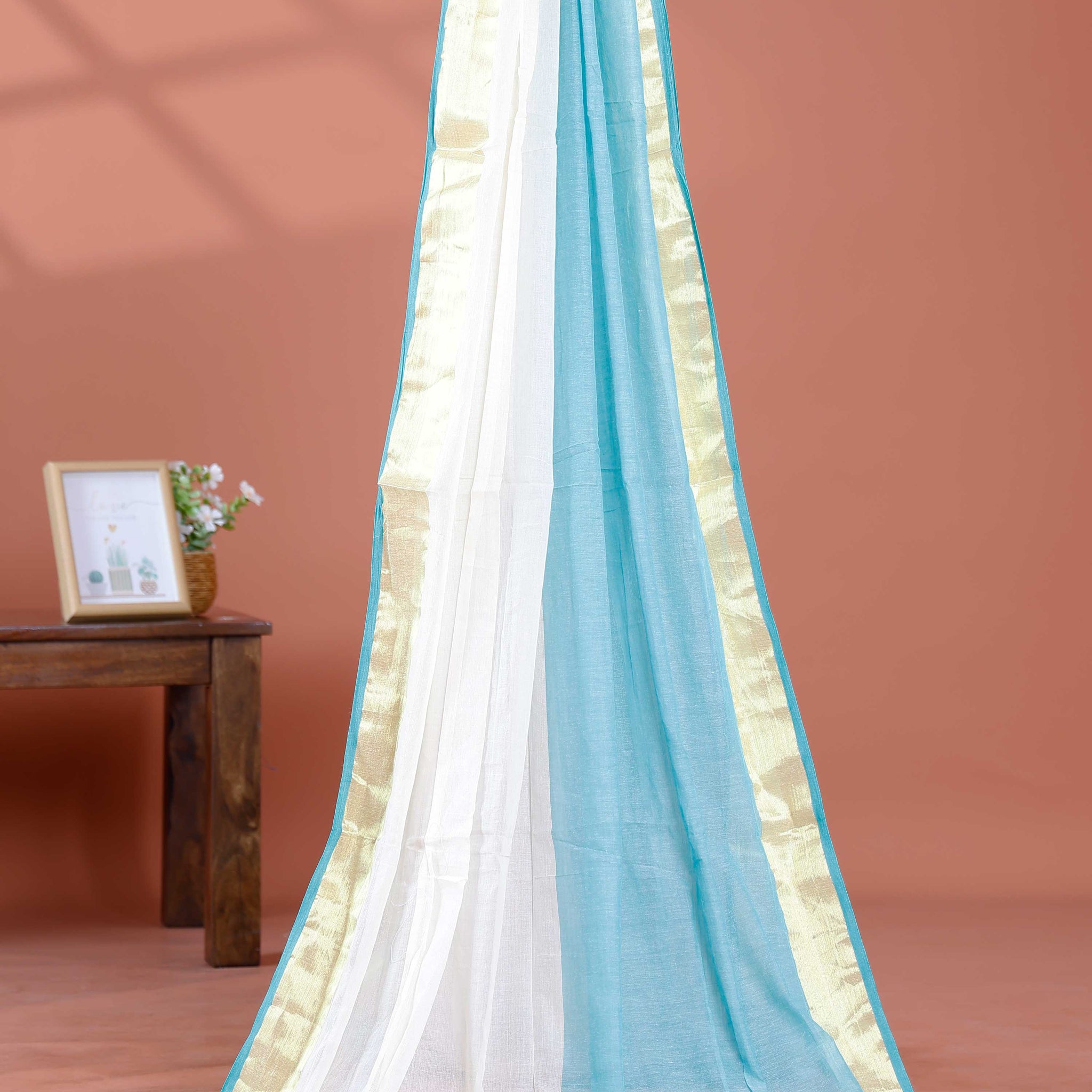 Handwoven Mul Mul Cotton Saree with Subtle Striped Pattern and Contrast Tassel Detailing – White