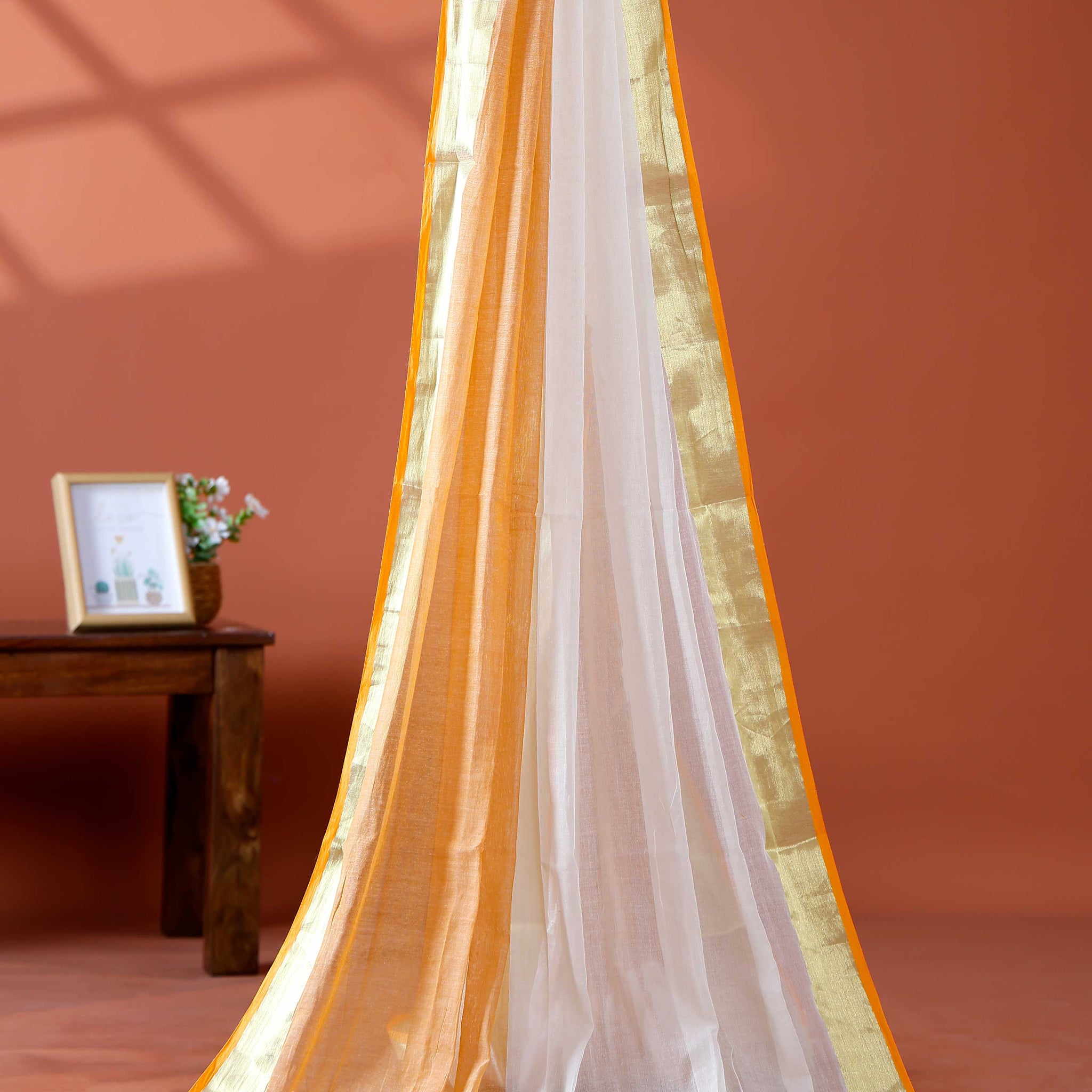 Handwoven Mul Mul Cotton Saree with Subtle Striped Pattern and Contrast Tassel Detailing – White