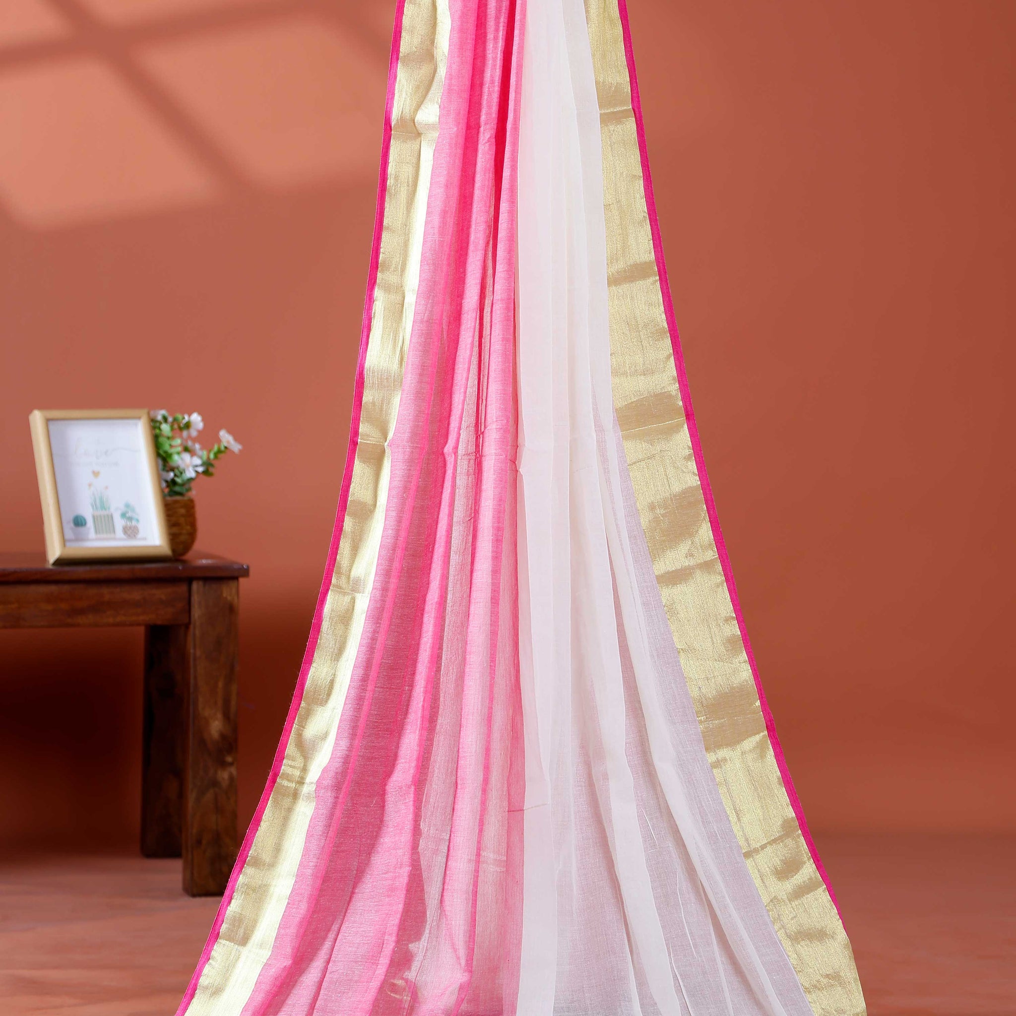 Handwoven Mul Mul Cotton Saree with Subtle Striped Pattern and Contrast Tassel Detailing – White