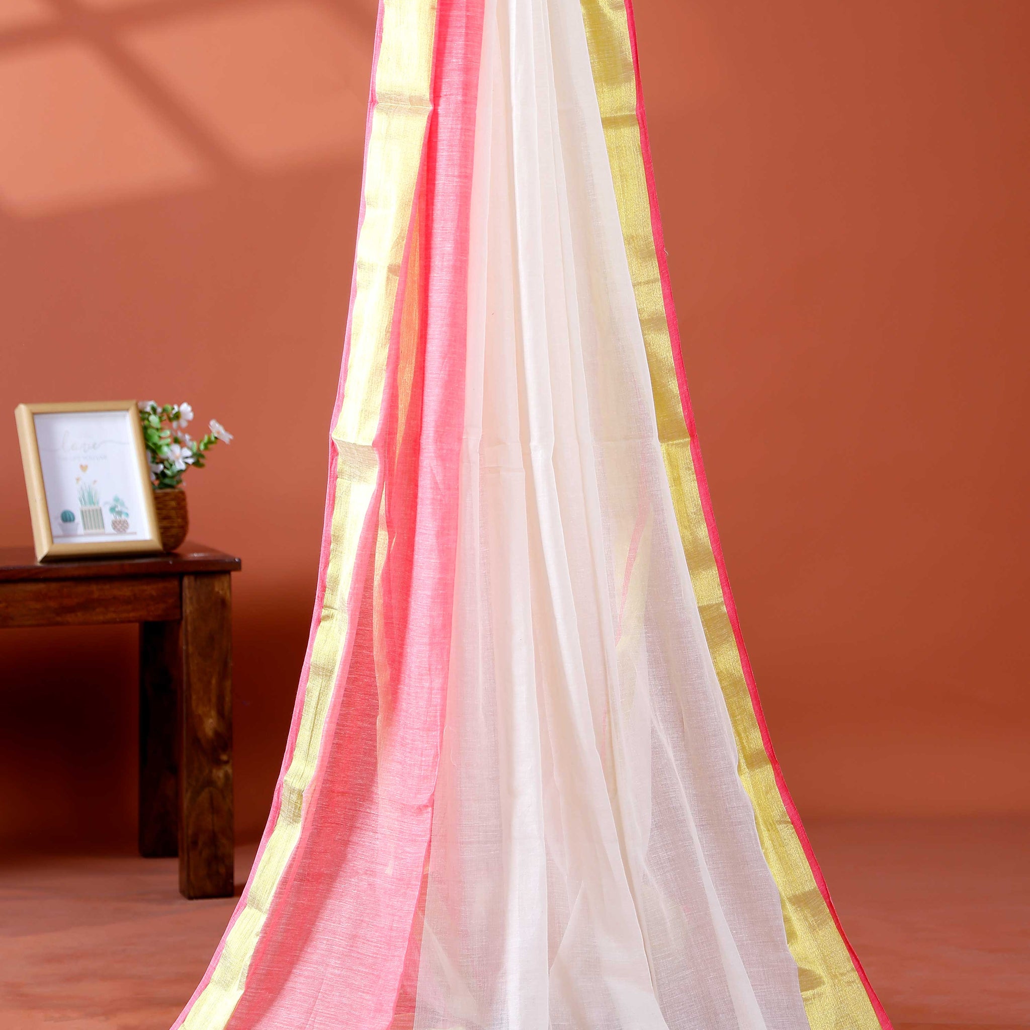 Handwoven Mul Mul Cotton Saree with Subtle Striped Pattern and Contrast Tassel Detailing – White
