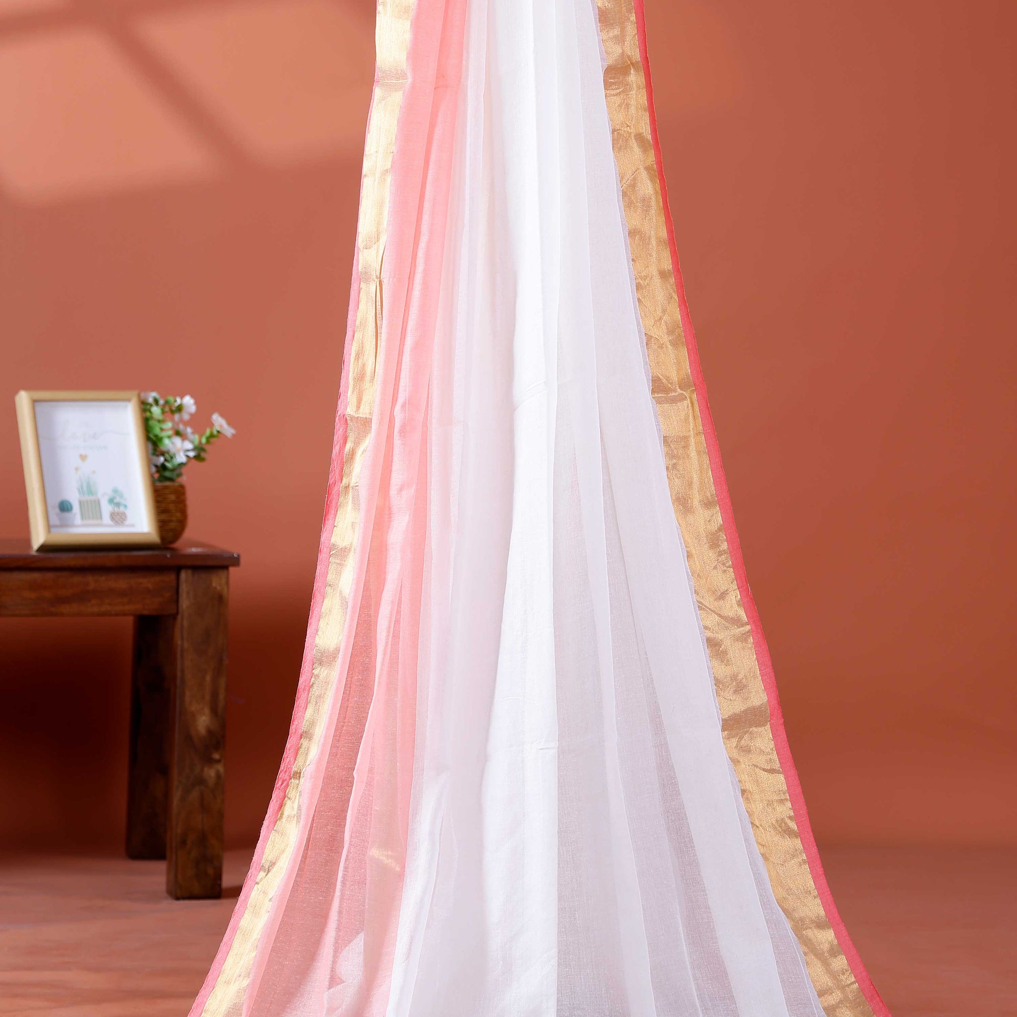 Handwoven Mul Mul Cotton Saree with Subtle Striped Pattern and Contrast Tassel Detailing – White