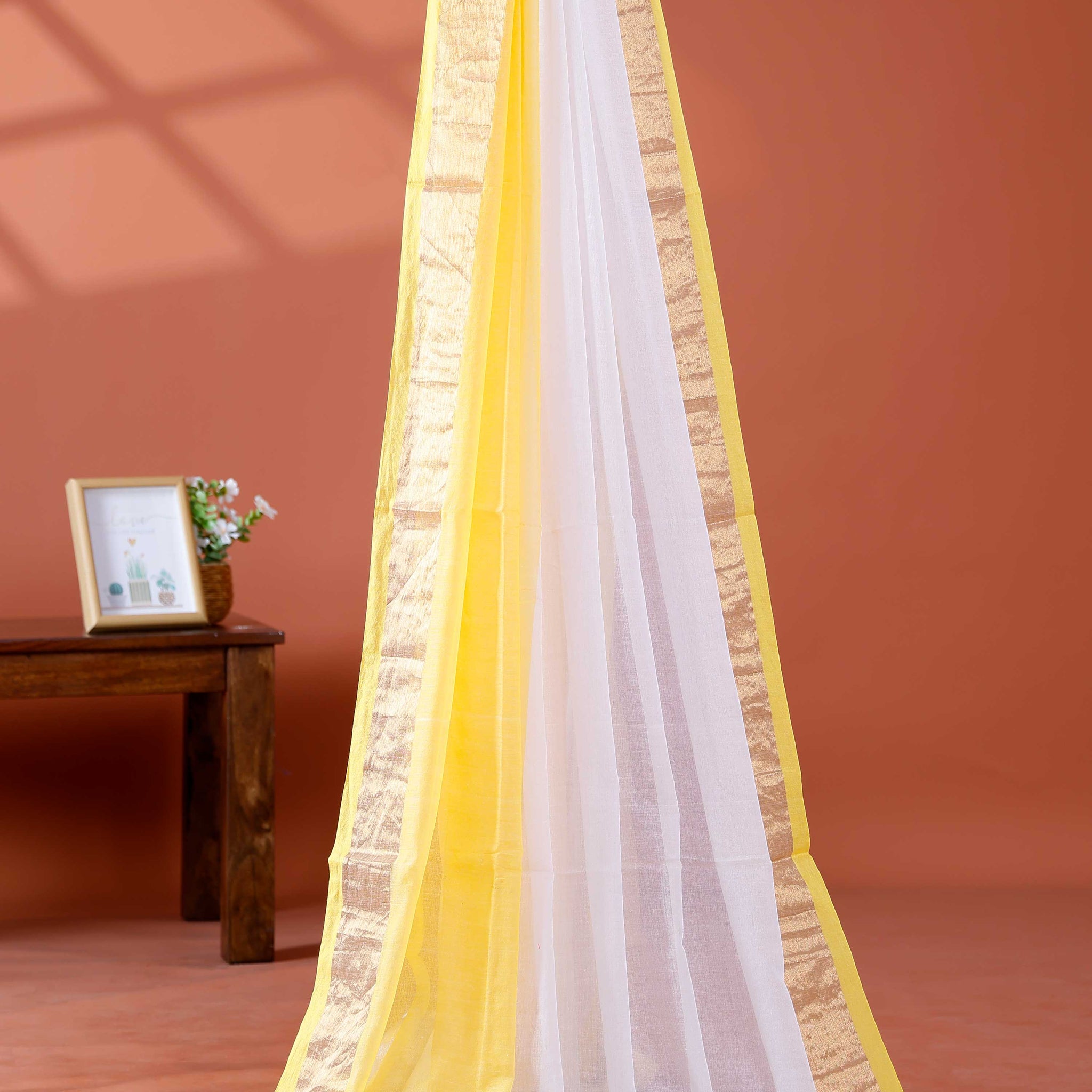 Handwoven Mul Mul Cotton Saree with Subtle Striped Pattern and Contrast Tassel Detailing – White