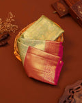 Classic Kanchipuram Tissue Silk Saree with Intricate Zari Weaving and Floral Motif Border - Green