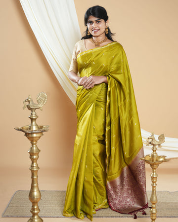 Elegant Handwoven Banarasi Silk Saree Accented with Subtle Zari Buttas and a Classic Zari Border - Green