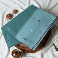 Dark Green Bengal Cotton Saree With Contrast White Striped Border And Woven Motifs Close Up Draped View