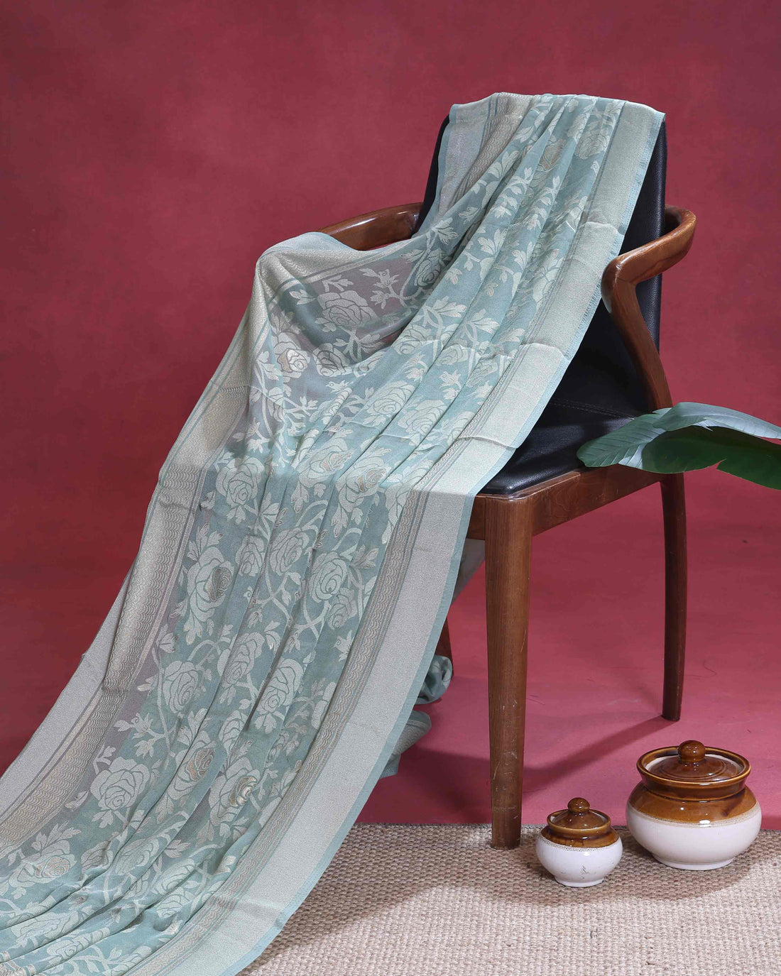 Elegant Dola Saree with Intricate Floral Motifs and Zari Border – Light Green