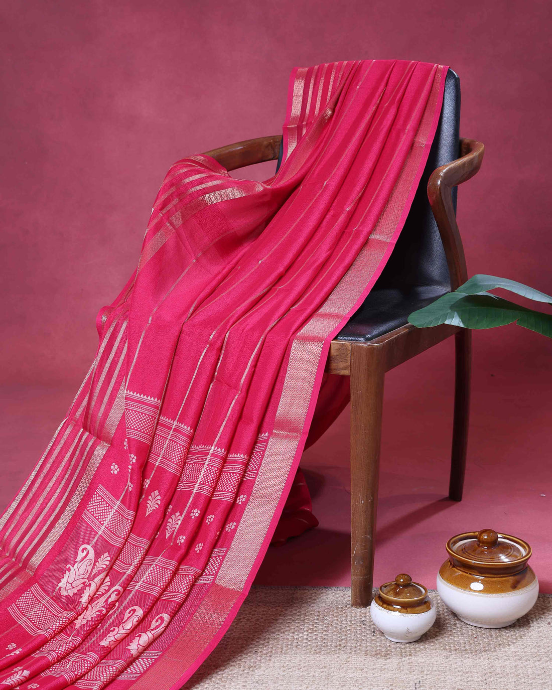 Elegant  Dola Saree with Striped Body and Intricate Zari Woven Paisley and Geometric Motif Contrast Border - Pink