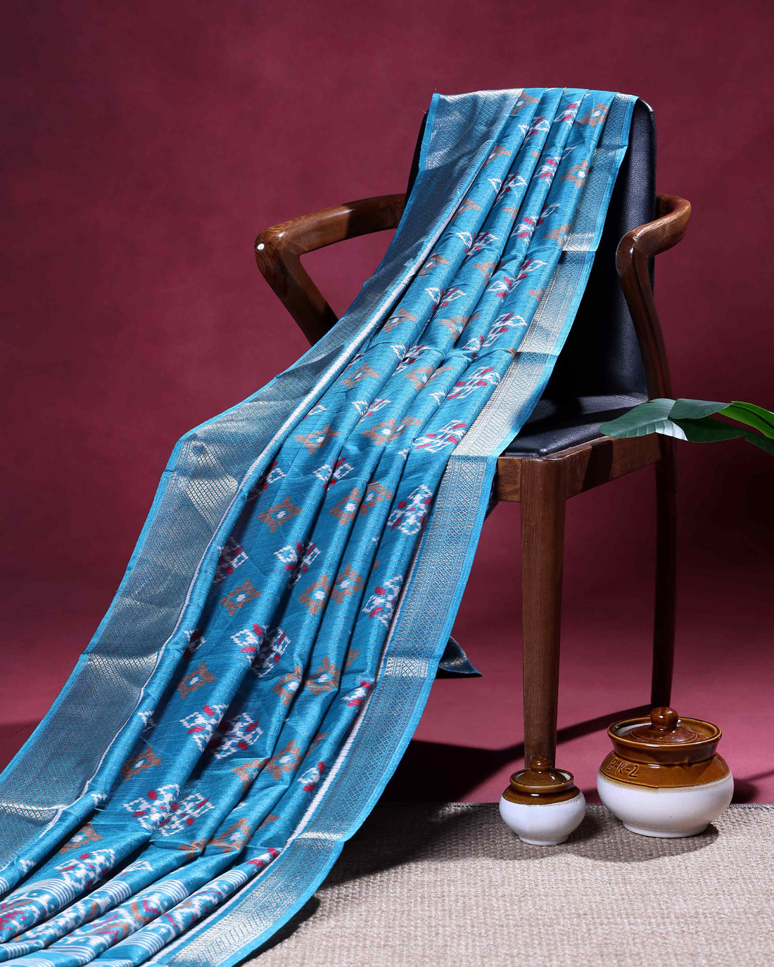 Elegant Dola Silk Saree with All-Over Ikkat Inspired Geometric Butta Motifs and Rich Traditional Zari Woven Border- Blue
