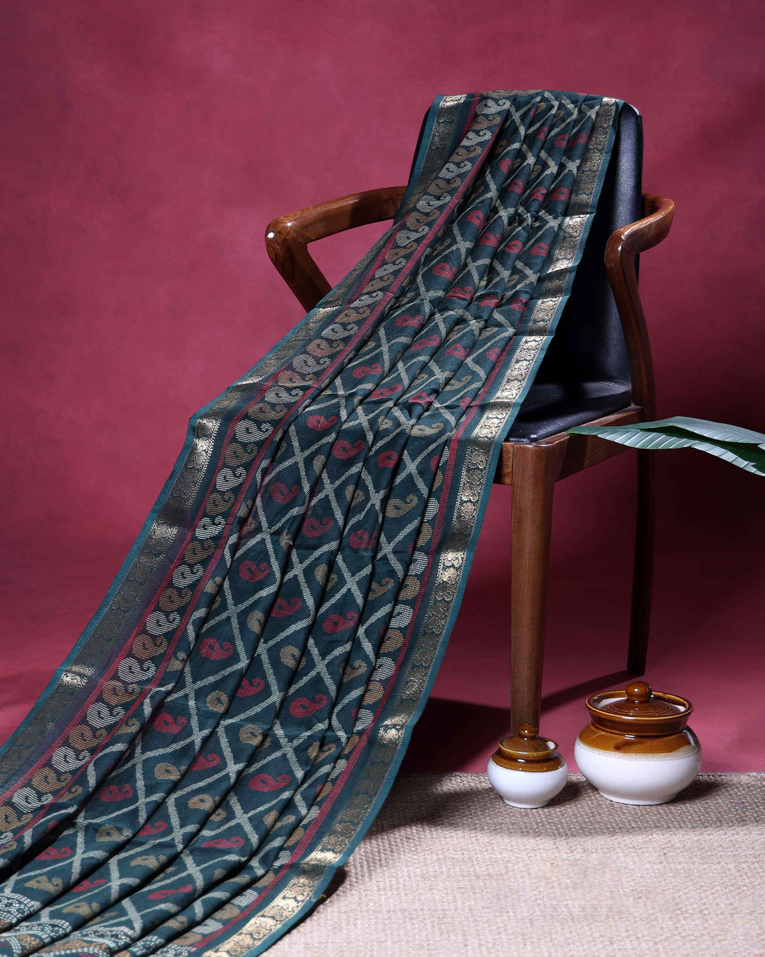 Elegant Dola Silk Saree with All Over Paisley Motifs in Geometric Diamond Pattern and Traditional Zari Woven Border - Dark Green