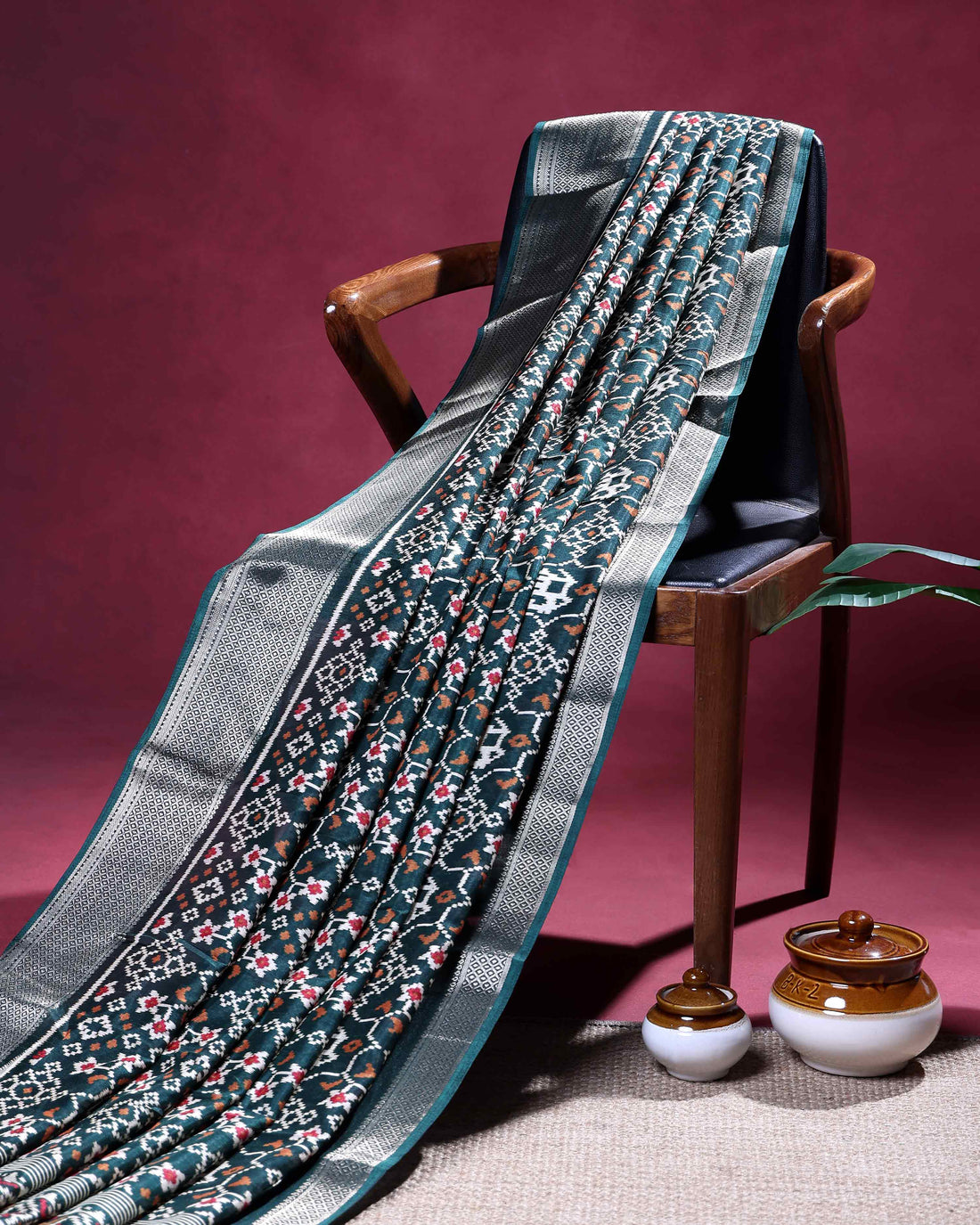 Elegant Dola Silk Saree with Ikkat Inspired Woven Motifs Intricate Floral and Butta Design and Zari Border - Dark Green