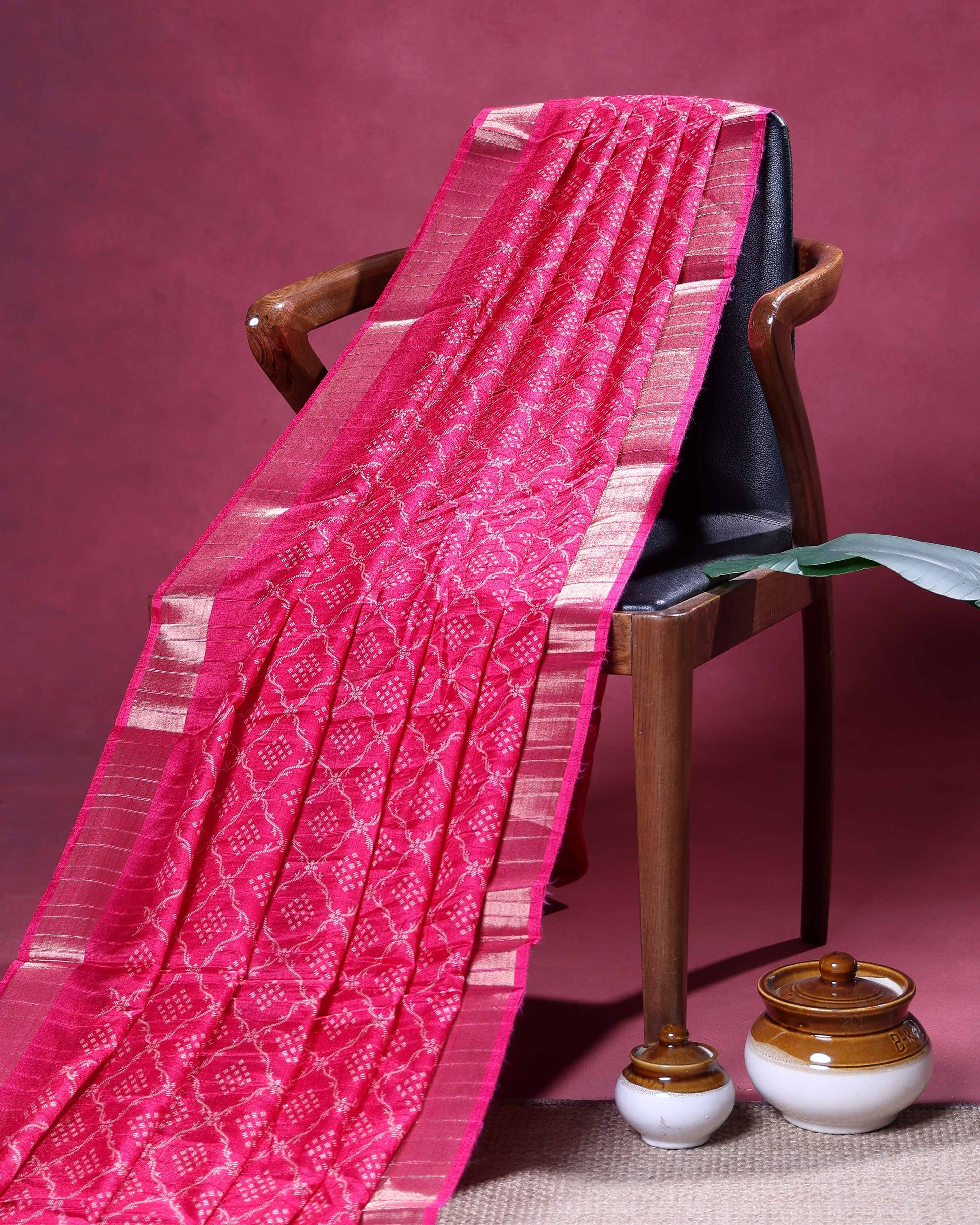 Elegant Dola Silk Saree with Intricate Geometric and Floral Pattern Enhanced by a Contrast Border - Pink