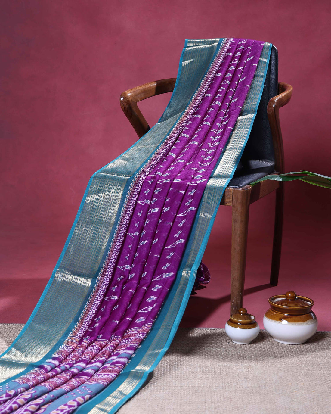 Elegant Dola Silk Saree with Intricate Ikkat Inspired Buta Motifs and Ornate Contrast Border -Purple