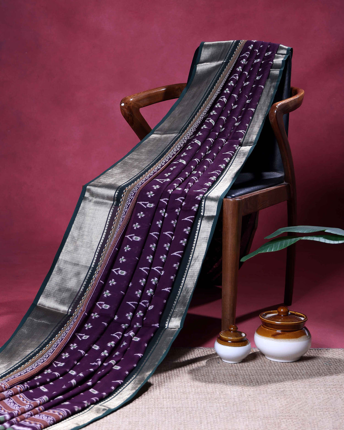 Elegant Dola Silk Saree with Intricate Ikkat Inspired Buta Motifs and Ornate Contrast Border - Dark Purple