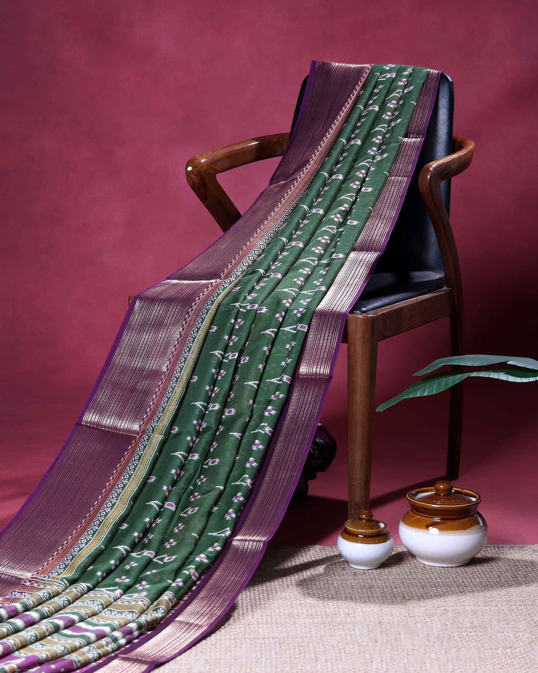 Elegant Dola Silk Saree with Intricate Ikkat Inspired Buta Motifs and Ornate Contrast Border - Green