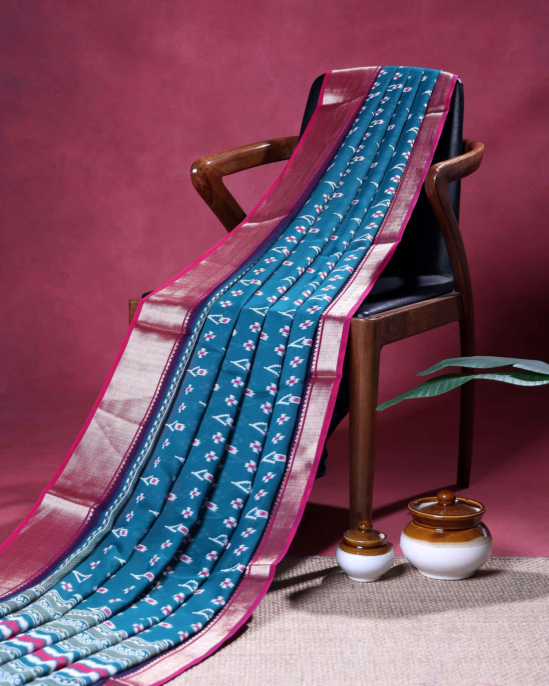 Elegant Dola Silk Saree with Intricate Ikkat Inspired Buta Motifs and Ornate Contrast Border - Teal Blue