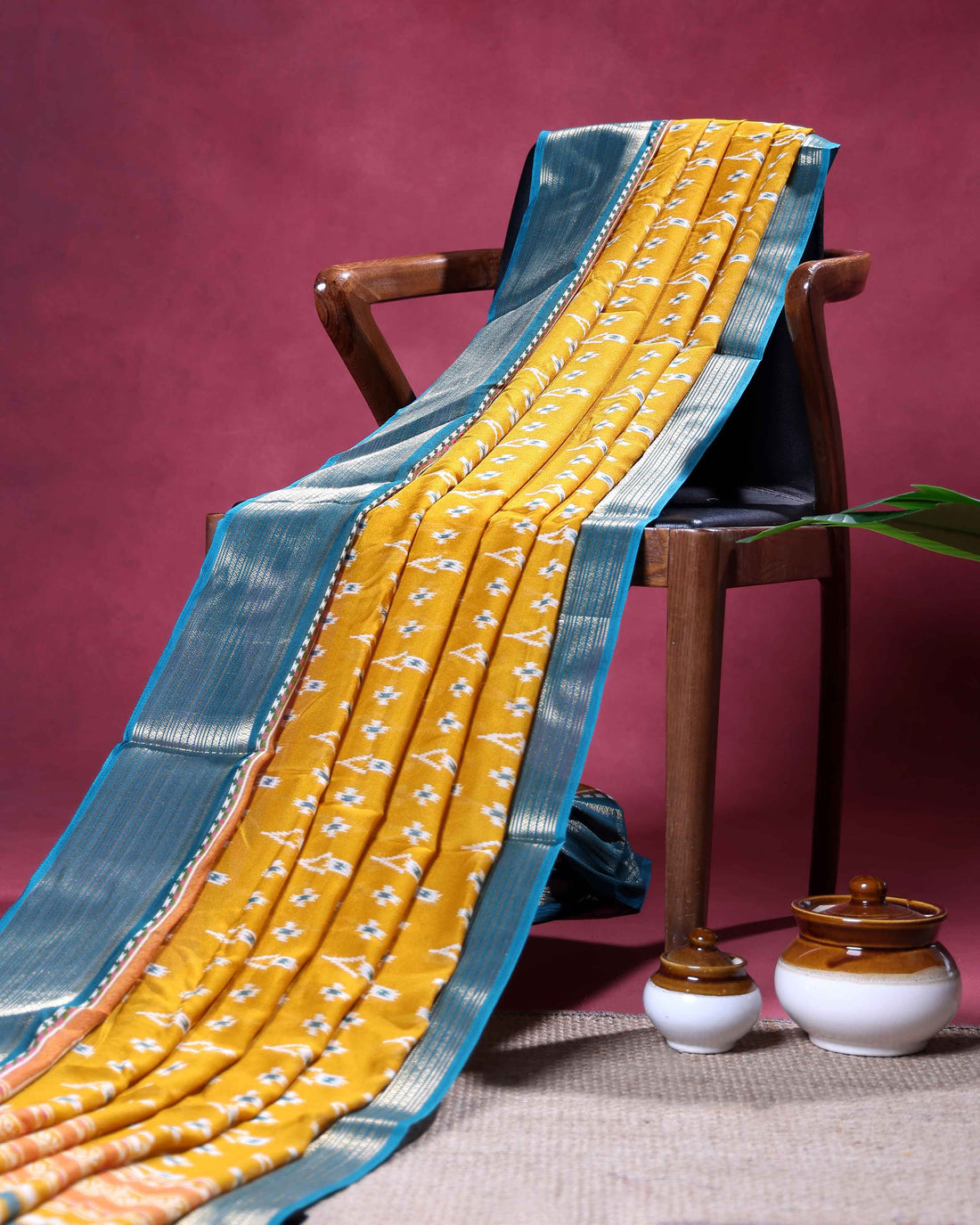 Elegant Dola Silk Saree with Intricate Ikkat Inspired Buta Motifs and Ornate Contrast Border - Yellow