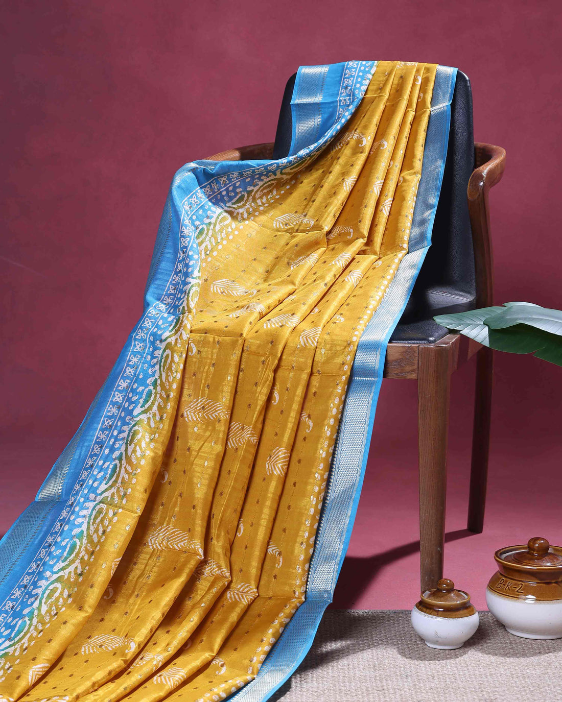 Elegant Dola Silk Saree with Traditional Paisley & Leaf Motifs and Rich Contrast Woven Border- Yellow