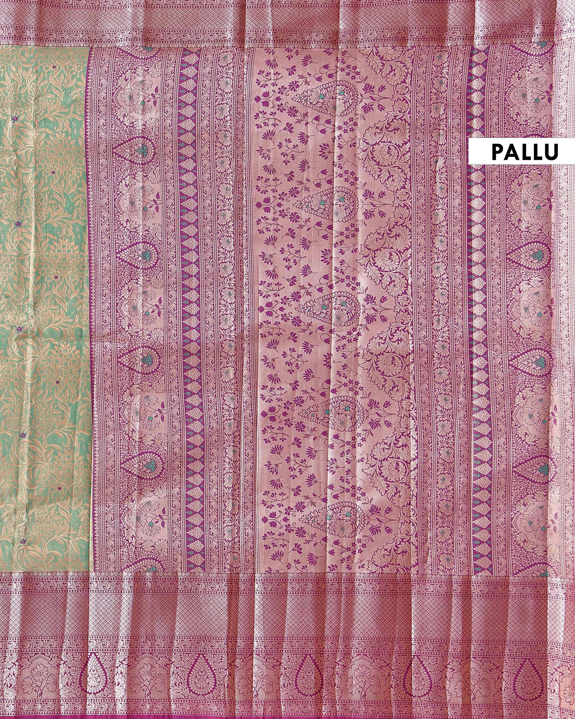 Elegant Niranjana Silk Saree Adorned with Detailed Zari Floral Patterns and Ornate Border - Green