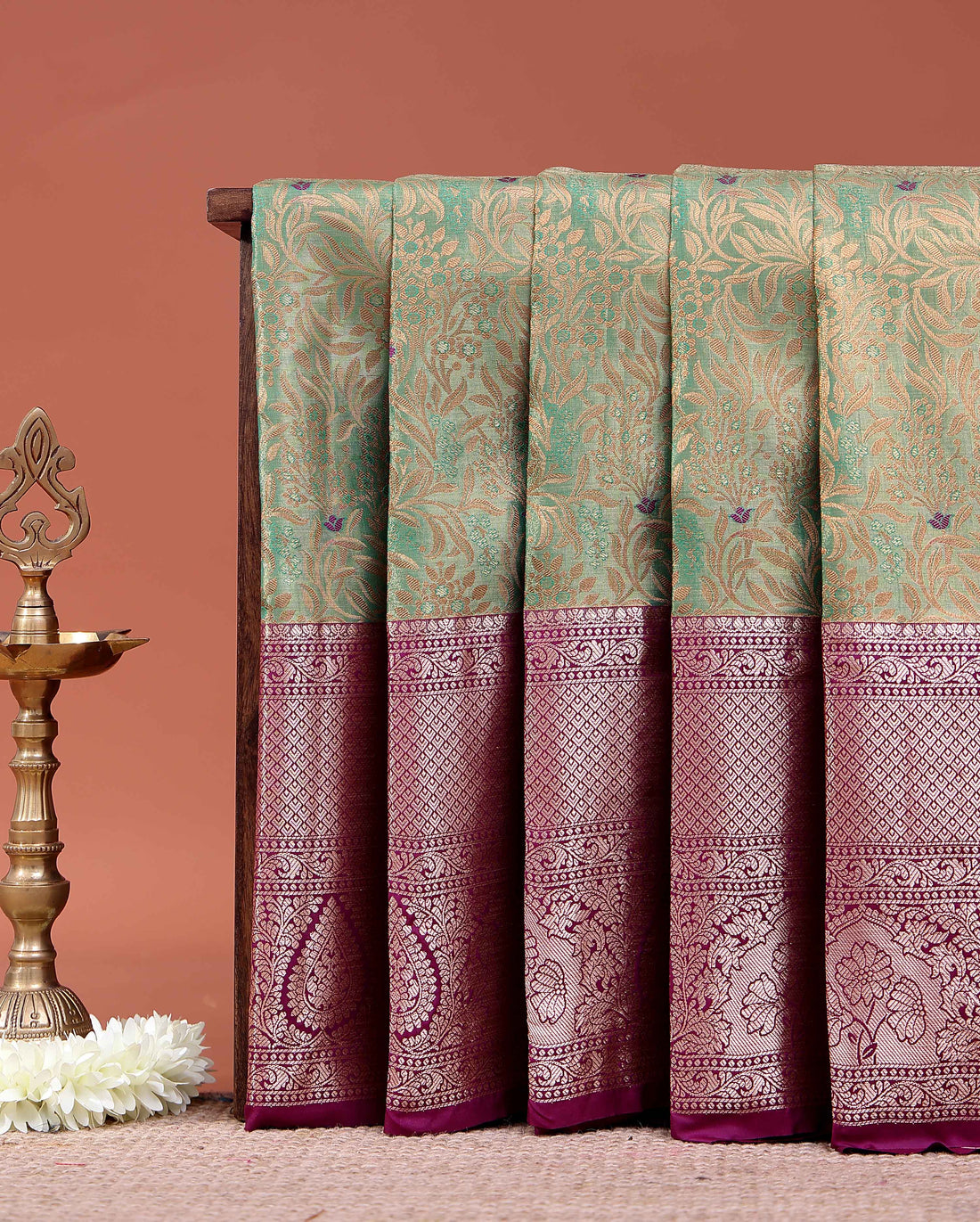 Elegant Niranjana Silk Saree Adorned with Detailed Zari Floral Patterns and Ornate Border - Green