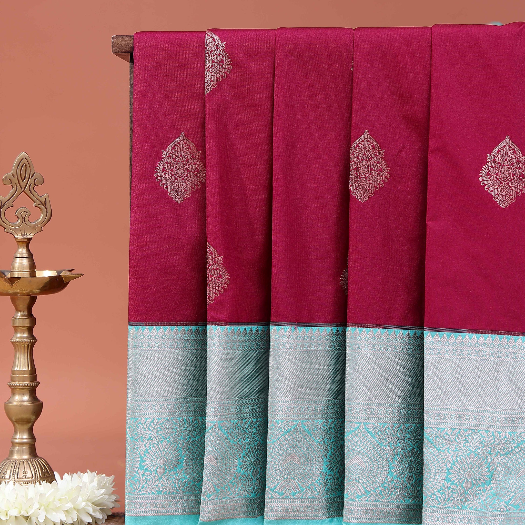 Elegant Niranjana Silk Saree Adorned with Fine Butta Motifs and Rich Zari Border - Maroon
