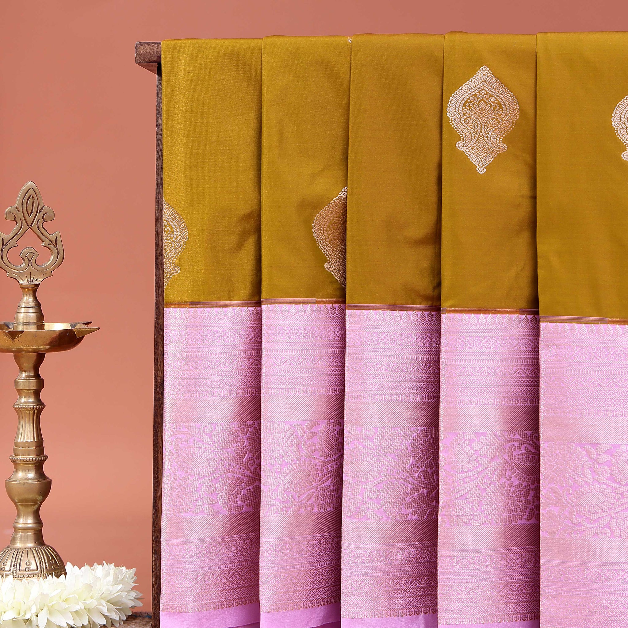 Elegant Niranjana Silk Saree Adorned with Refined Butta Design and Ornate Zari Border - Olive Green