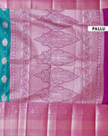 Elegant Niranjana Silk Saree with Intricate Floral Brocade Weaving and Rich Contrast Border - Teal