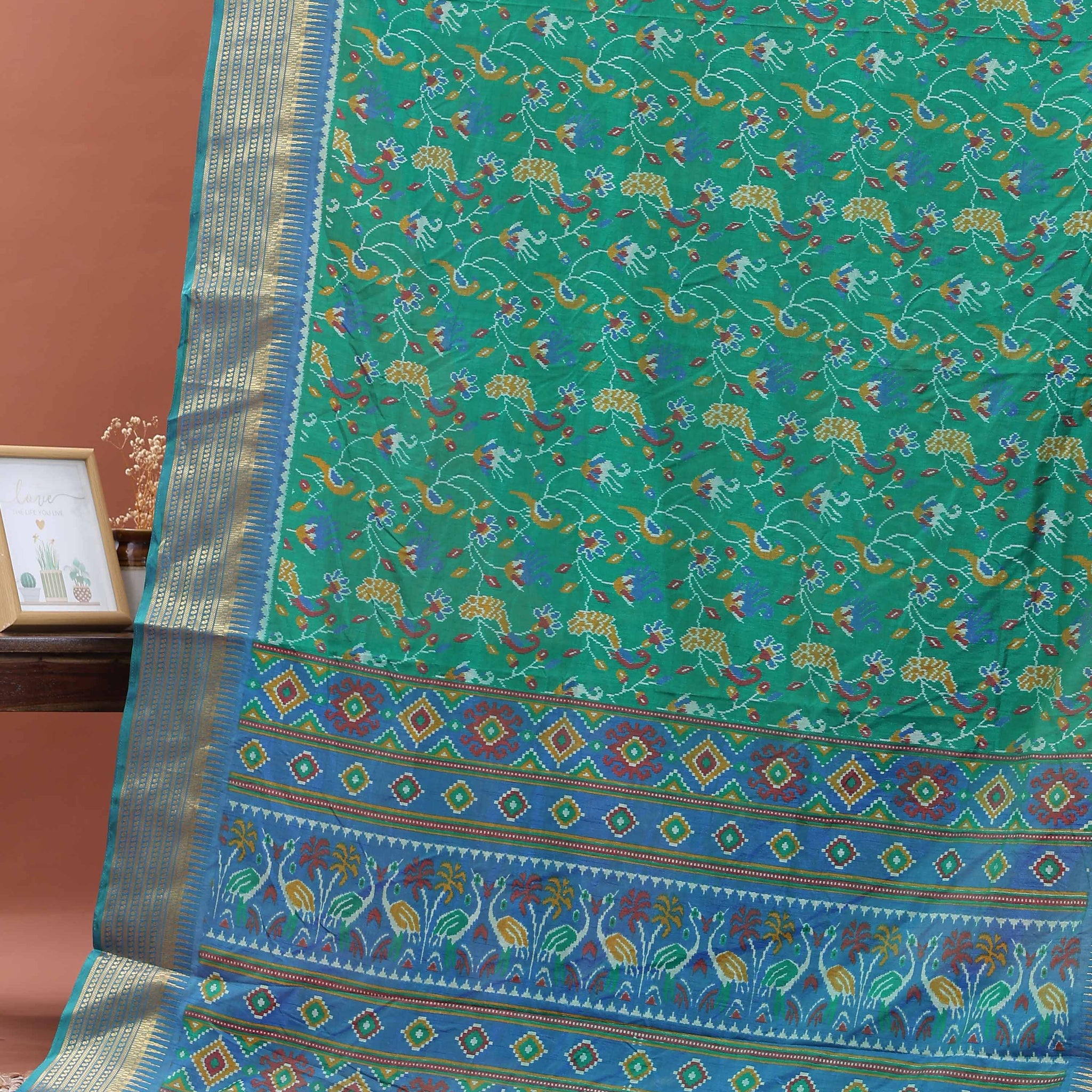 Elegant Patola Saree with Classic Peacock and Geometric Border - Green
