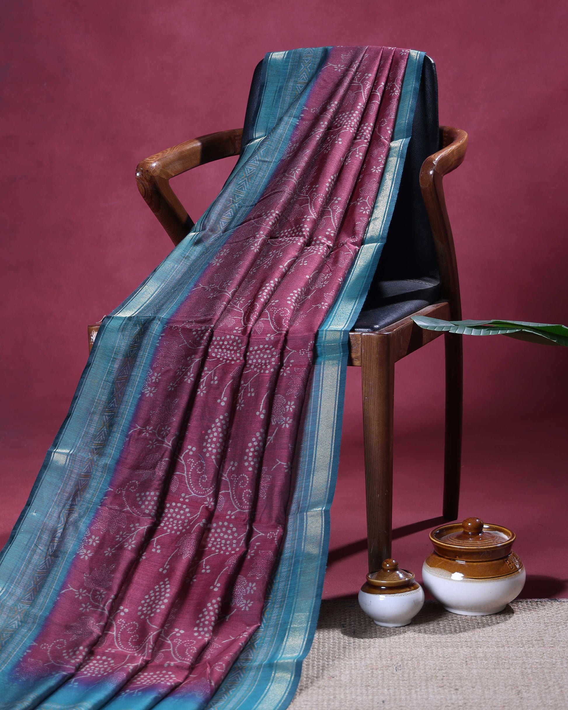 Elegant Semi Chanderi Saree with All-Over Floral Vine Buta Motifs and Intricately Contrast Zari Border  - Maroon
