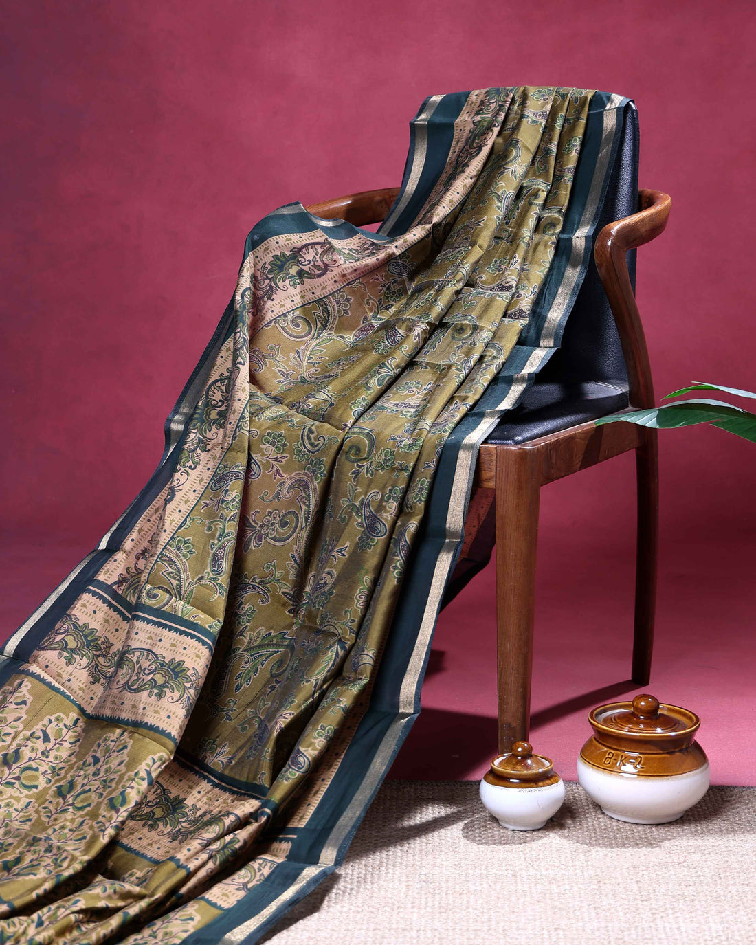 Elegant Semi Chanderi Saree with Paisley Inspired Motifs and A Plain Gold Woven Border - Green