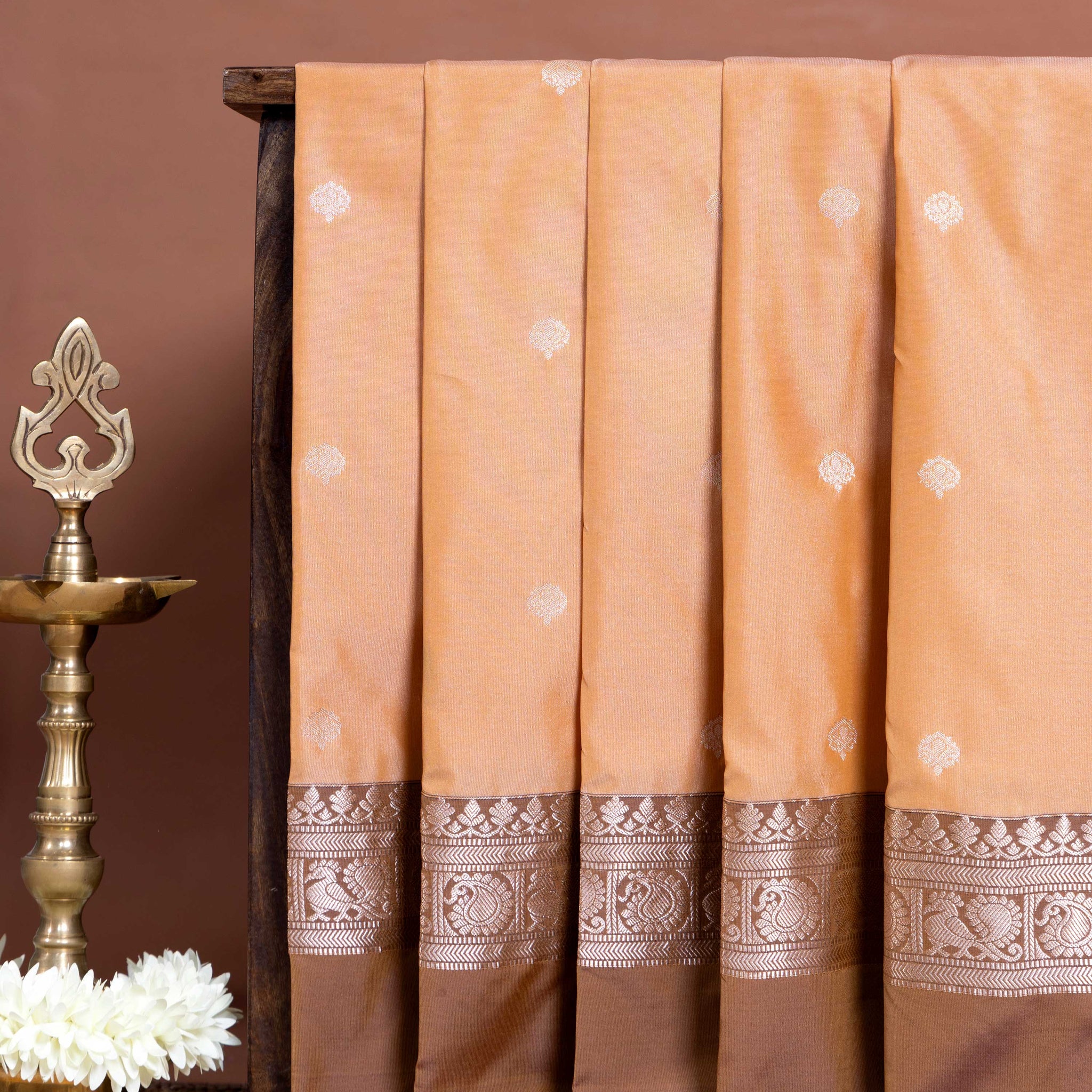 
Elegant Soft Silk Saree with Delicate Zari Buttas and Peacock Motif Contrast Border  - Peach
