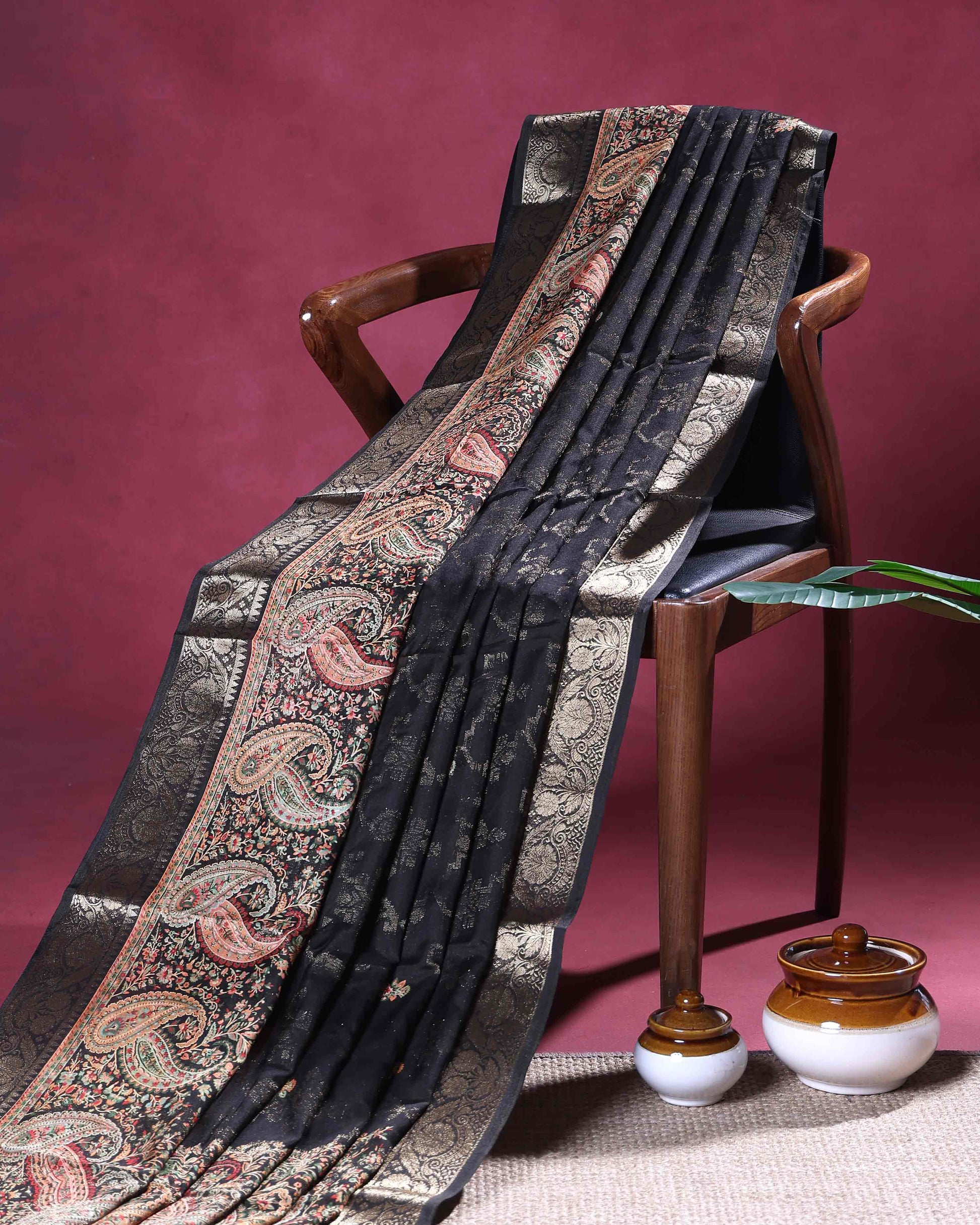 Graceful Dola Silk Saree with Paisley & Floral Motif Woven Butta Design and Traditional Zari Border  - Black