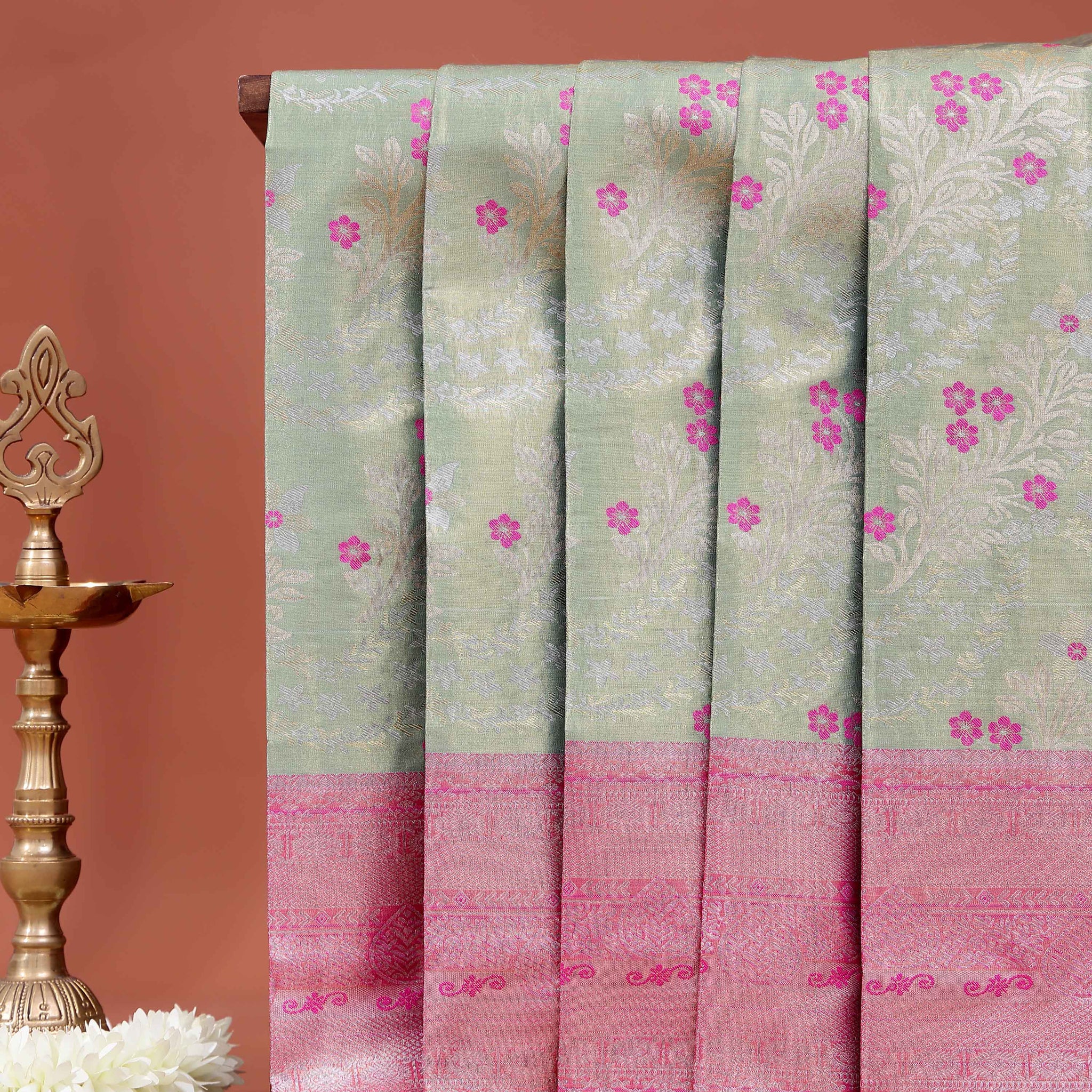 Graceful Niranjana Silk Saree Adorned with Small Floral Motifs and Traditional Zari Border - Green
