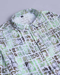 Green and white patterned shirt on a light gray background