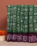 Handcrafted Sungudi Cotton Saree with Intricate Wax Batik Design and Contrast Border - Dark Green