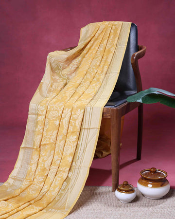 Elegant Dola Saree with Intricate Floral Motifs and Zari Border – Yellow