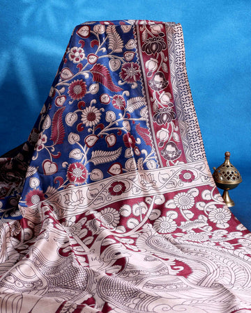 Traditional Raw Silk Saree with Floral Motifs Intricate Kalamkari Inspired Pallu and Woven Border - Blue