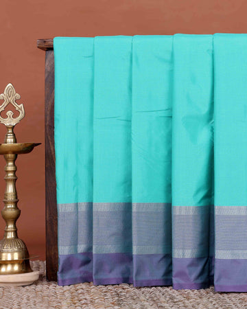 Elegant Semi Soft Silk Saree with Plain Body and Contrast Zari Woven Border - Turquoise Blue